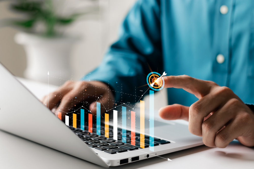 finger pointing at an upward virtual bar chart