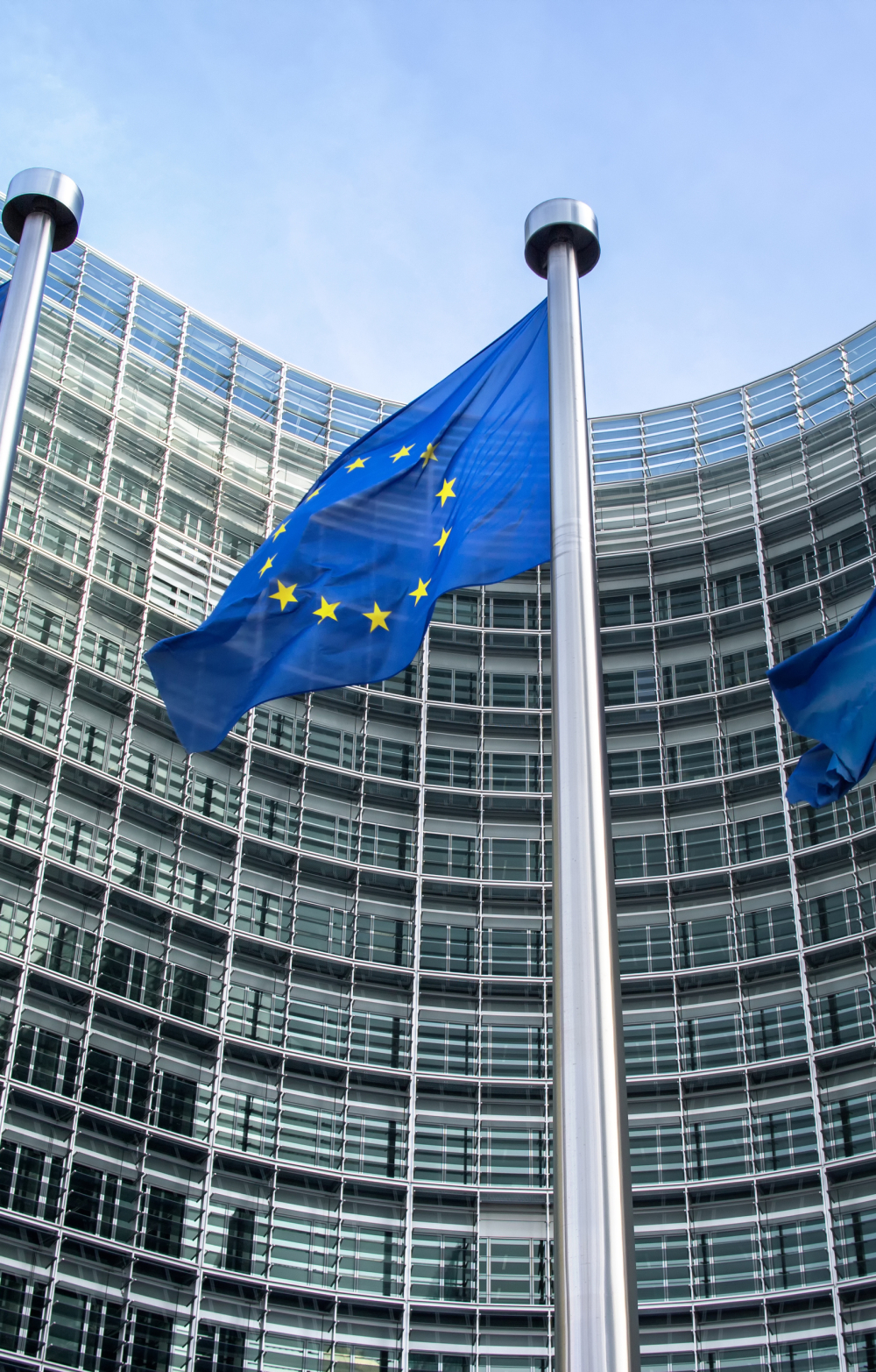 3 EU flags full mast in front of the EU Commission Berlaymont building in Brussels